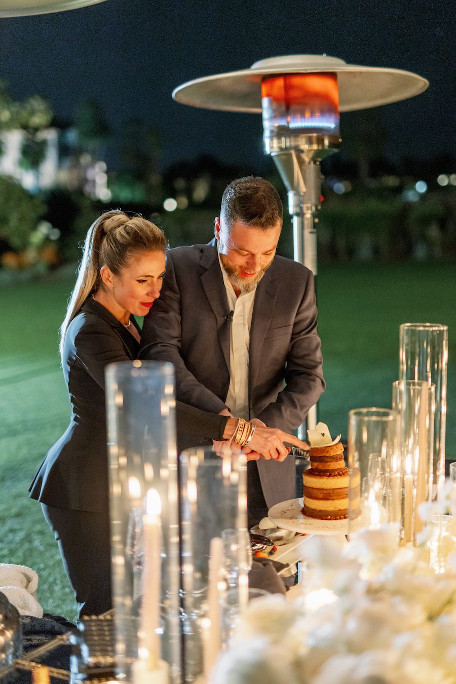 Cutting the cake together at their luxury 20 year anniversary and ocean view proposal in southern California