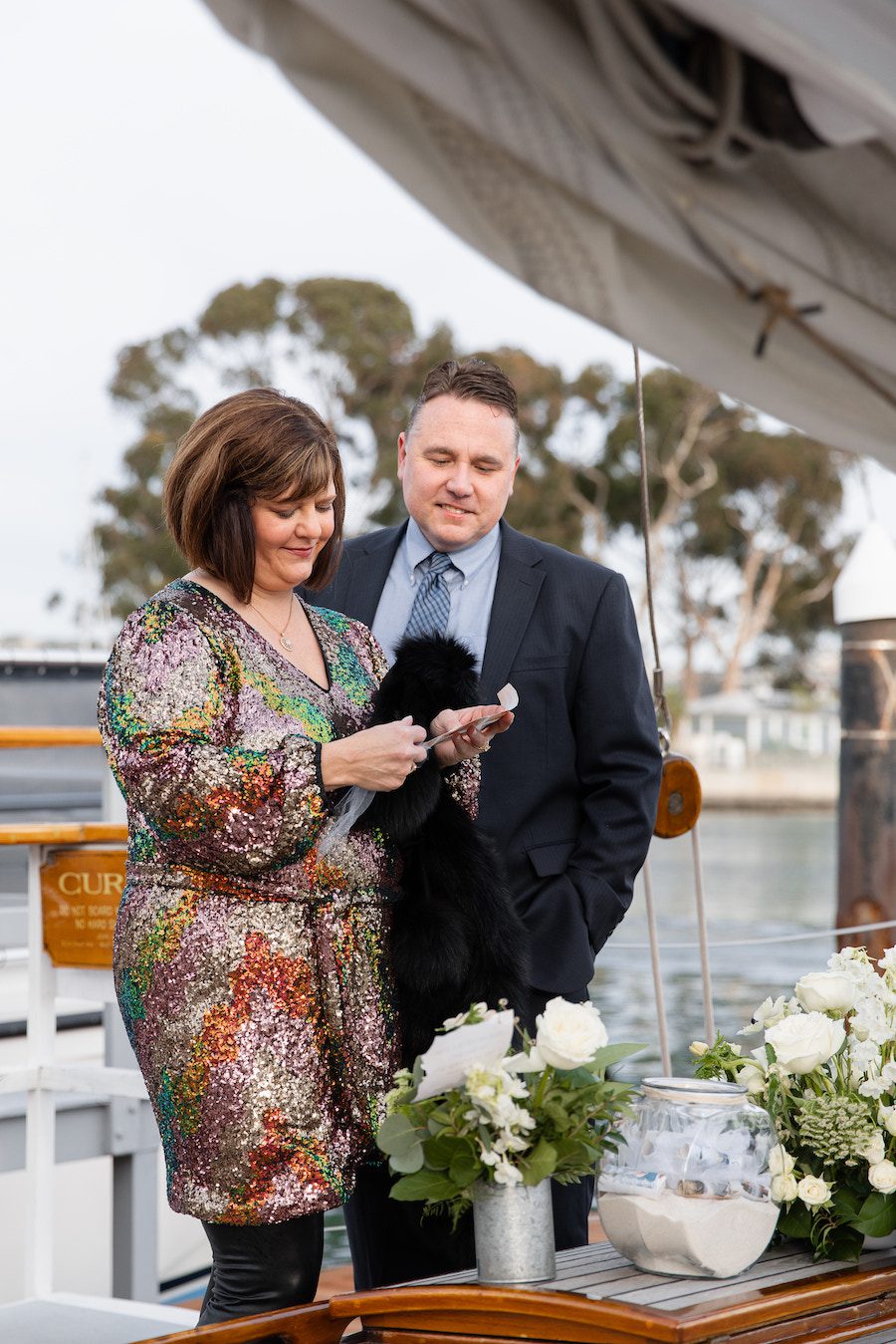 Reading custom notes written to her during this adorable sunset sail proposal 