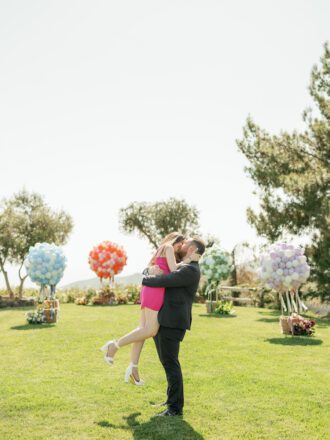 happy couple engaged with stunning malibu proposal by the yes girls