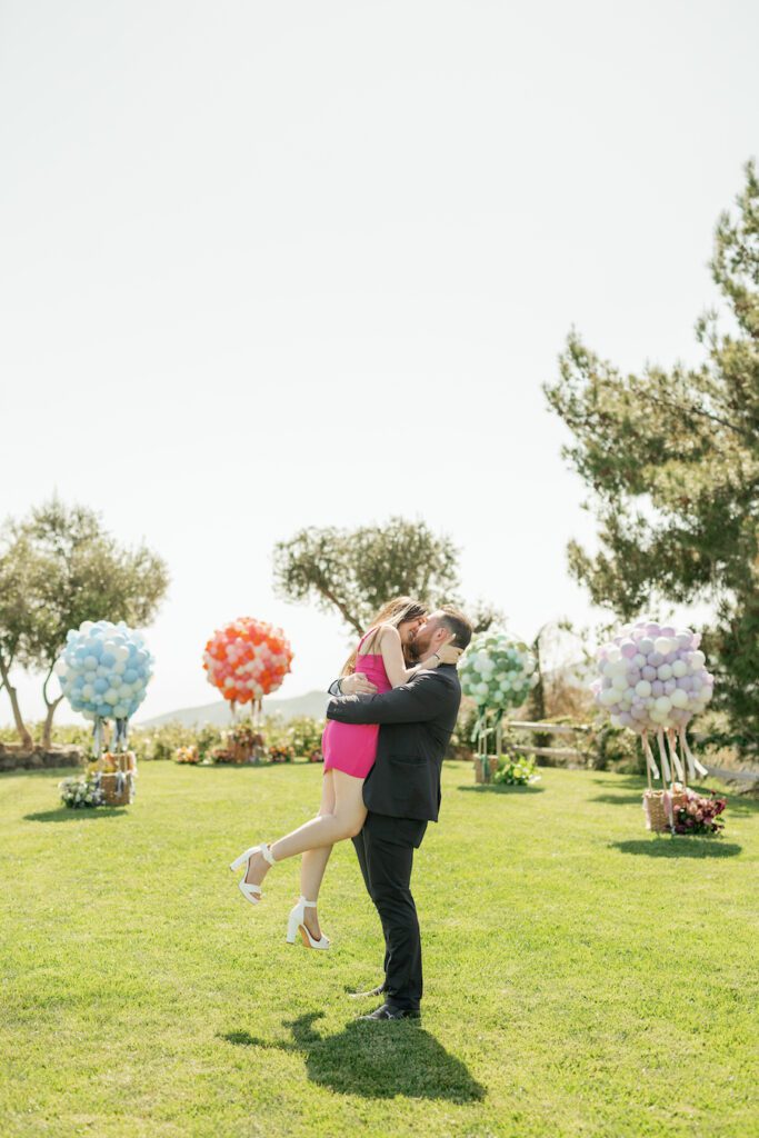 happy couple engaged with stunning malibu proposal by the yes girls