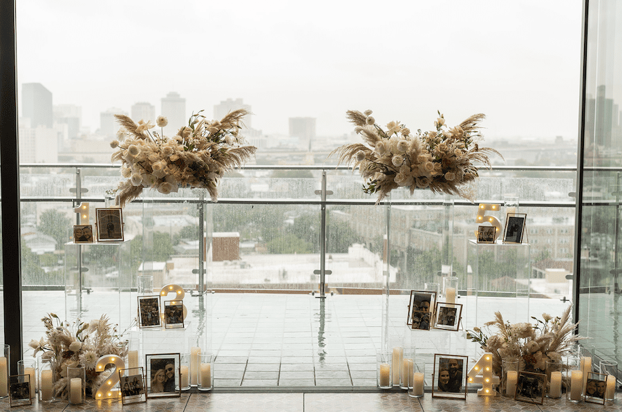 Romantic rooftop proposal in new orleans neutral florals, photo details, acrylic risers, light up numbers