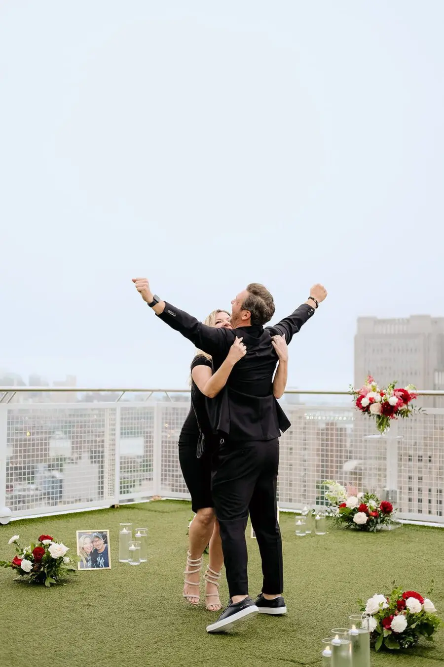 luxury proposal nyc skyline proposal rooftop proposal red flower proposal