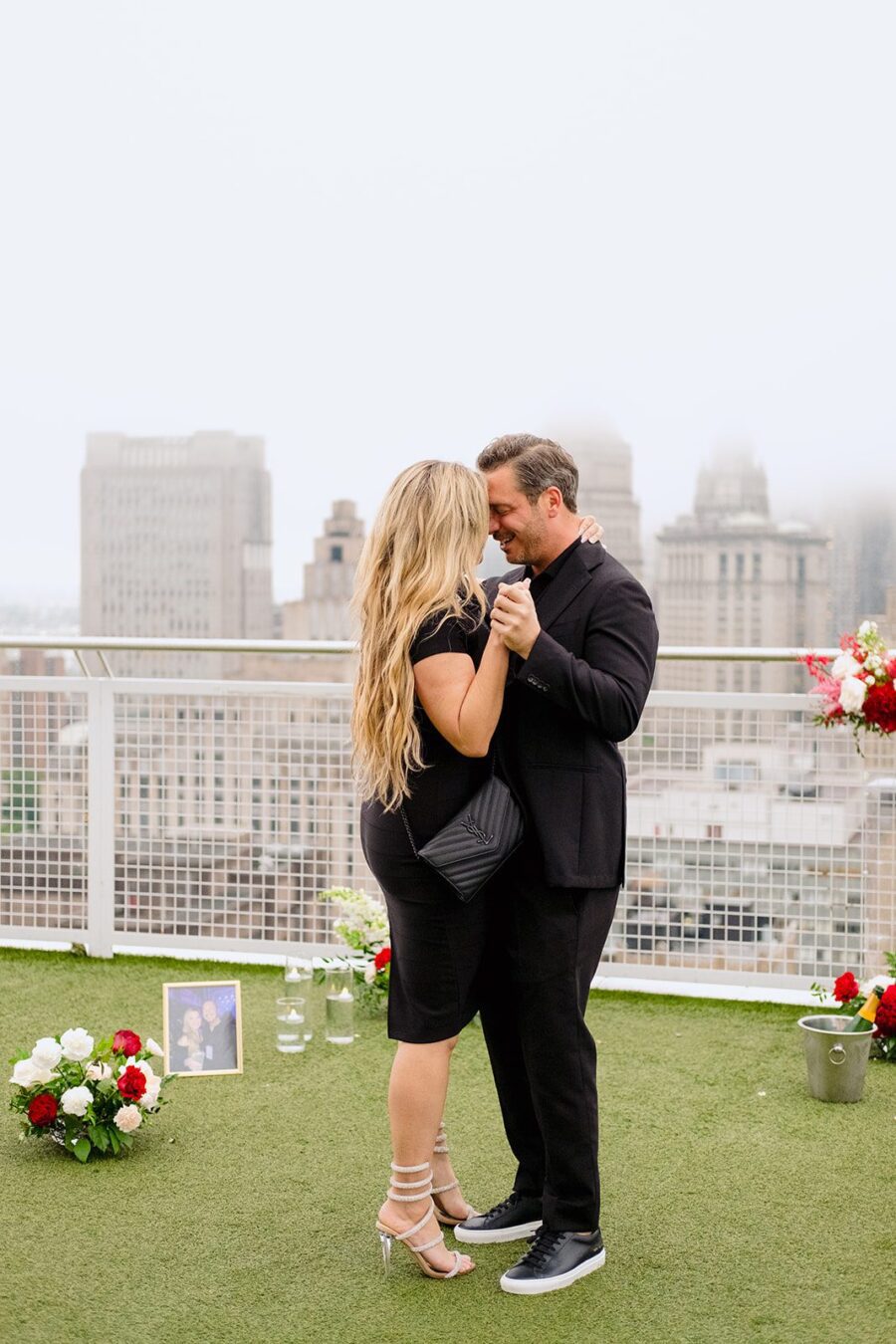 luxury proposal nyc skyline proposal rooftop proposal red flower proposal slow dancing