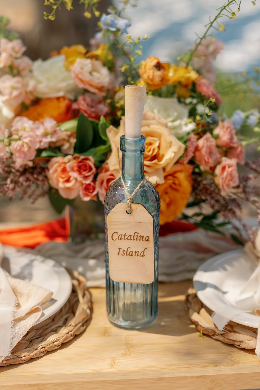 Private Picnic Proposal on Catalina Island. Charcuterie board, champagne, and picnic table set up for the proposal with an ocean view