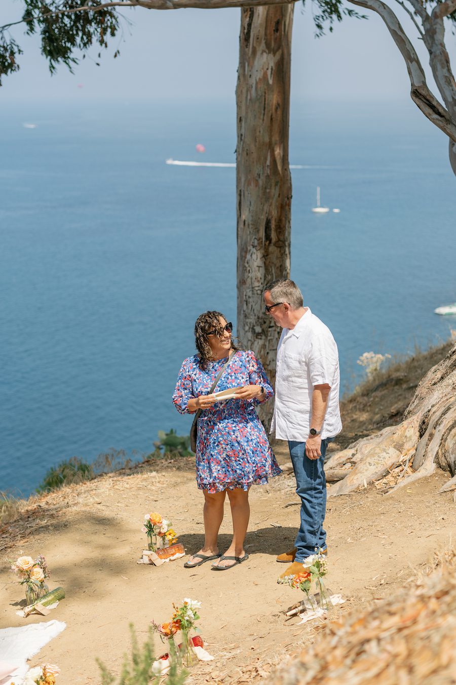 Private Picnic Proposal on Catalina Island. Charcuterie board, champagne, and picnic table set up for the proposal with an ocean view