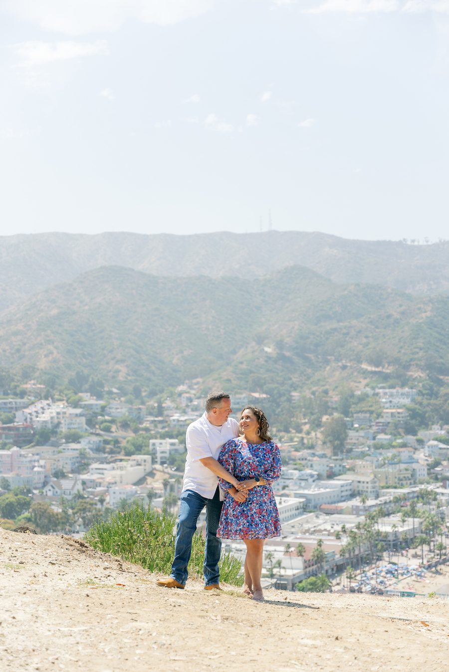 Private Picnic Proposal on Catalina Island. Charcuterie board, champagne, and picnic table set up for the proposal with an ocean view