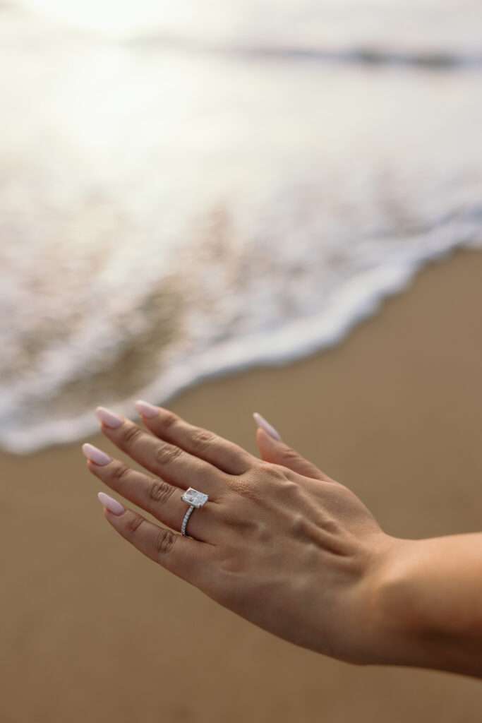 Engagement Ring on the beach with waves