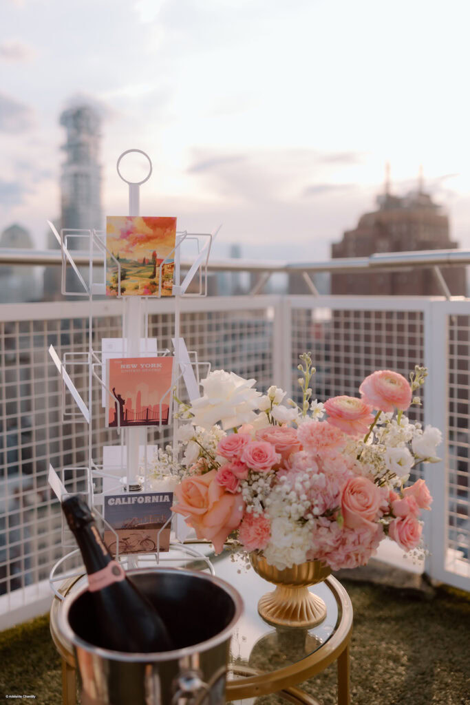 pink floral arrangement and postcards for a proposal