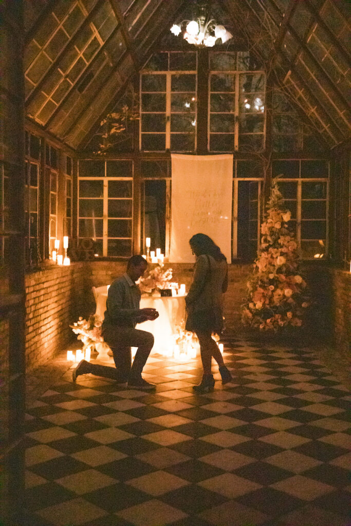 Austin TX proposal at the sought-after checkered floor glasshouse with romantic candlelight