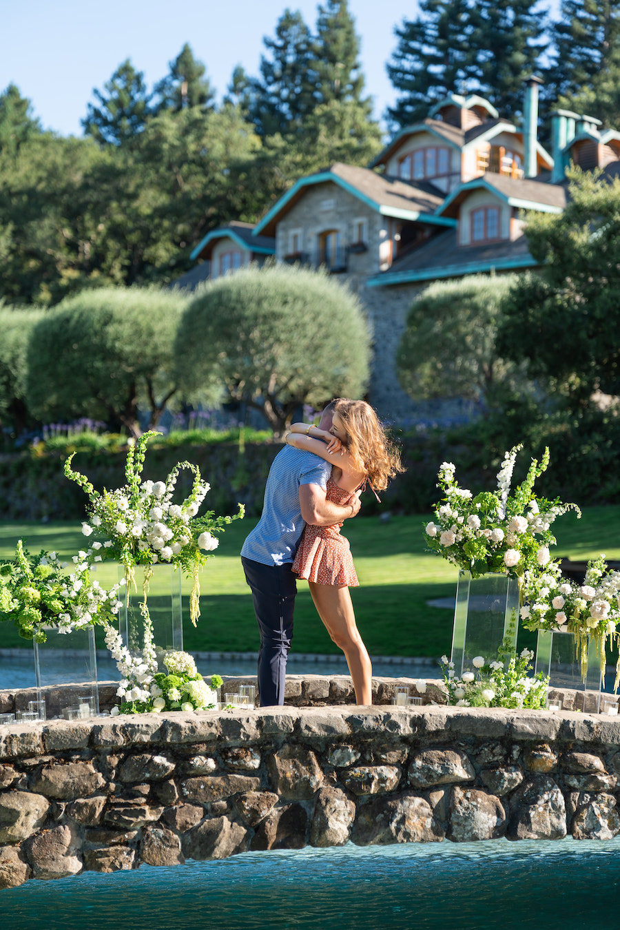 Picture-perfect winery proposal in Napa Valley with white florals and garden views by The Yes Girls