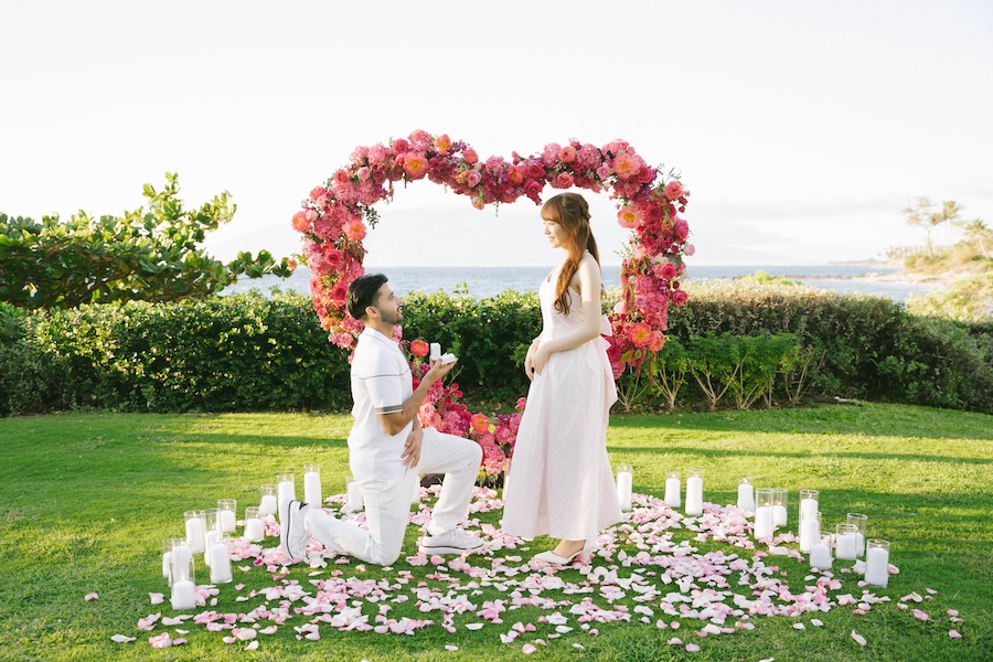 Pink rose heart arch and candles on an oceanfront lawn at the Andaz Maui