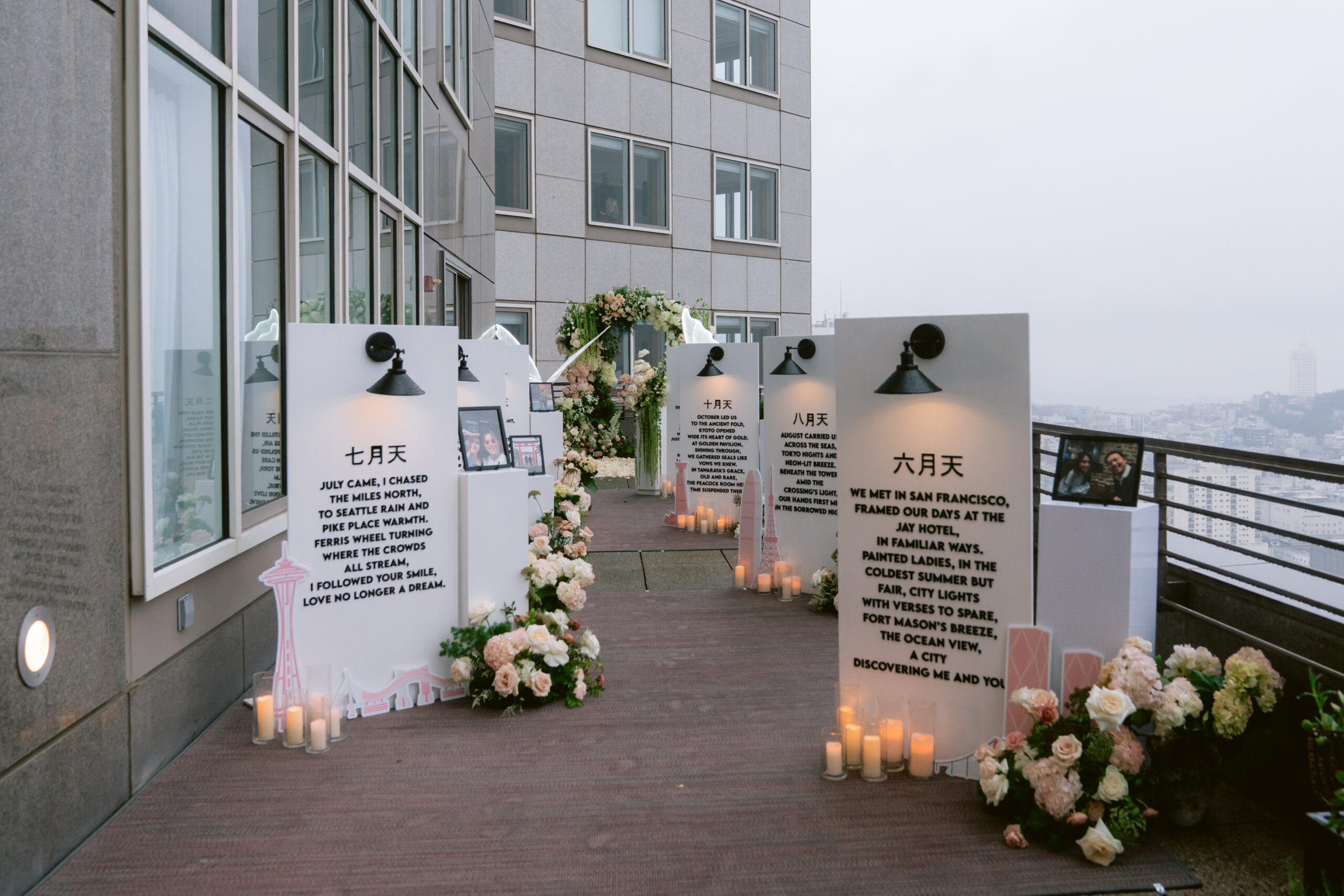 Candlelit petal aisle leading to the floral arch on the rooftop