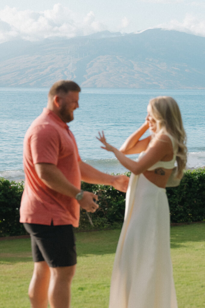 The moment of the proposal with ocean and mountain views at the Grand Wailea, Maui
