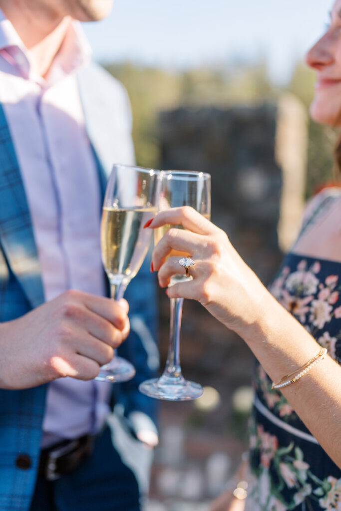 Champagne toast with her new engagement ring