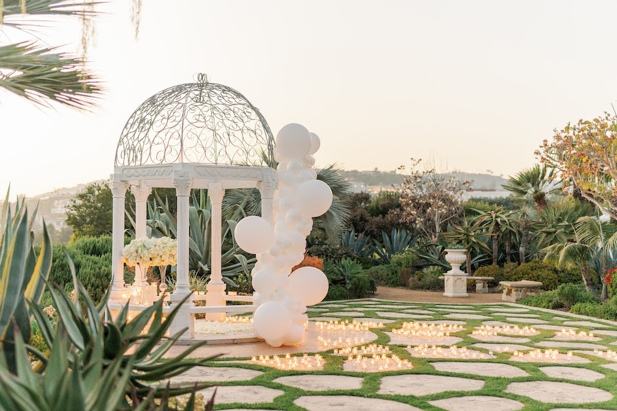 Wide view of the white gazebo proposal setup surrounded by gardens in Orange County