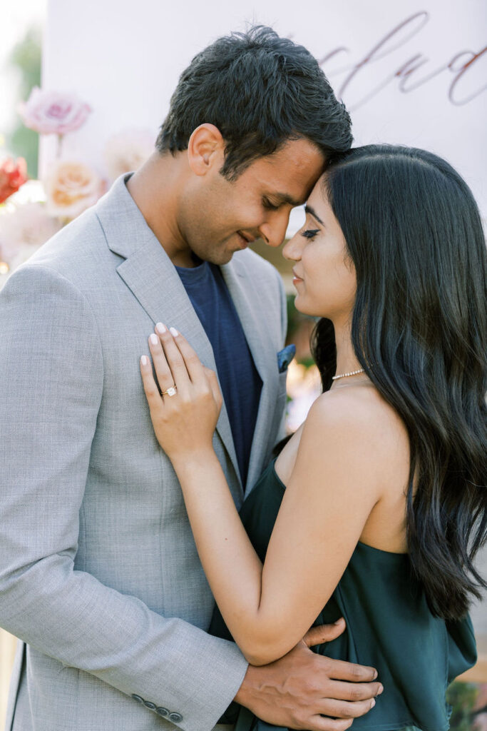 Couple touching foreheads after the proposal