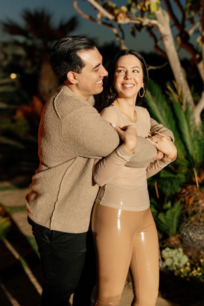 Newly engaged couple smiling and hugging after their Orange County gazebo proposal
