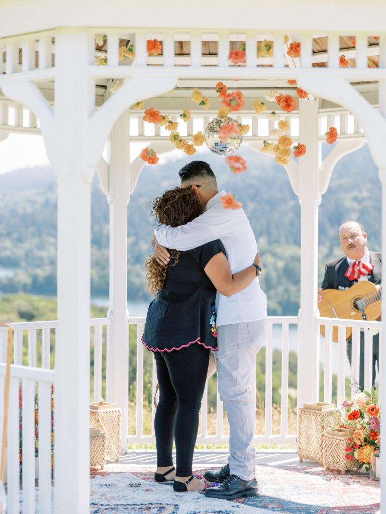 Couple hugging after she said yes