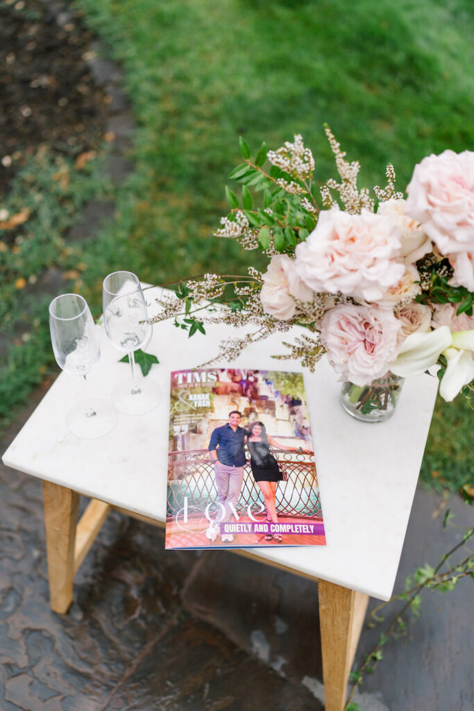 Framed photo of the couple among blush roses