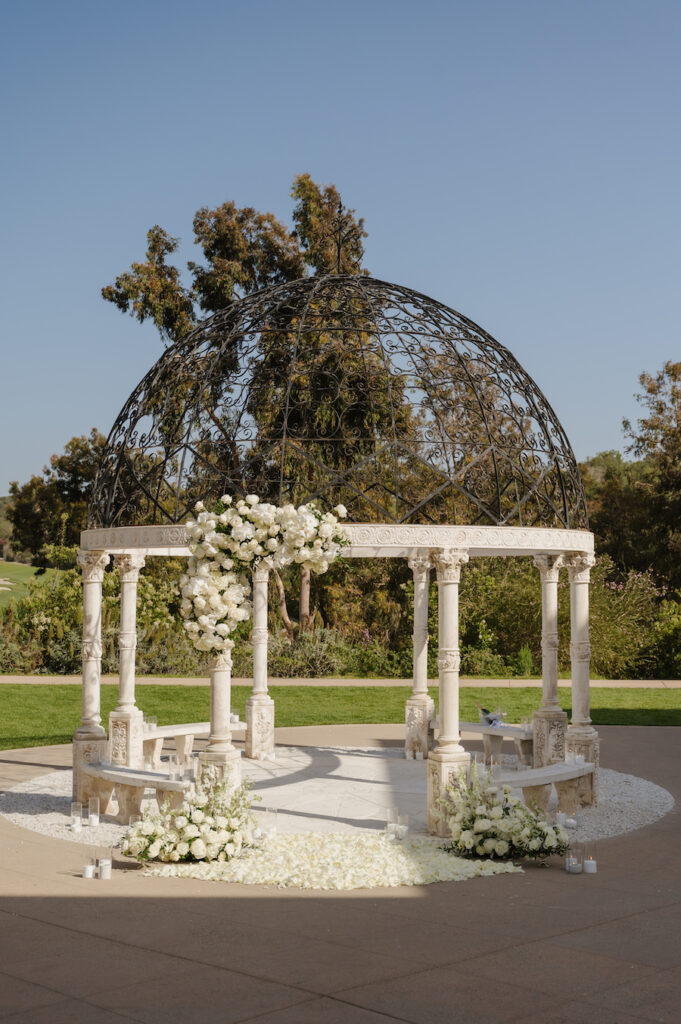 All-white floral gazebo proposal setup in San Diego