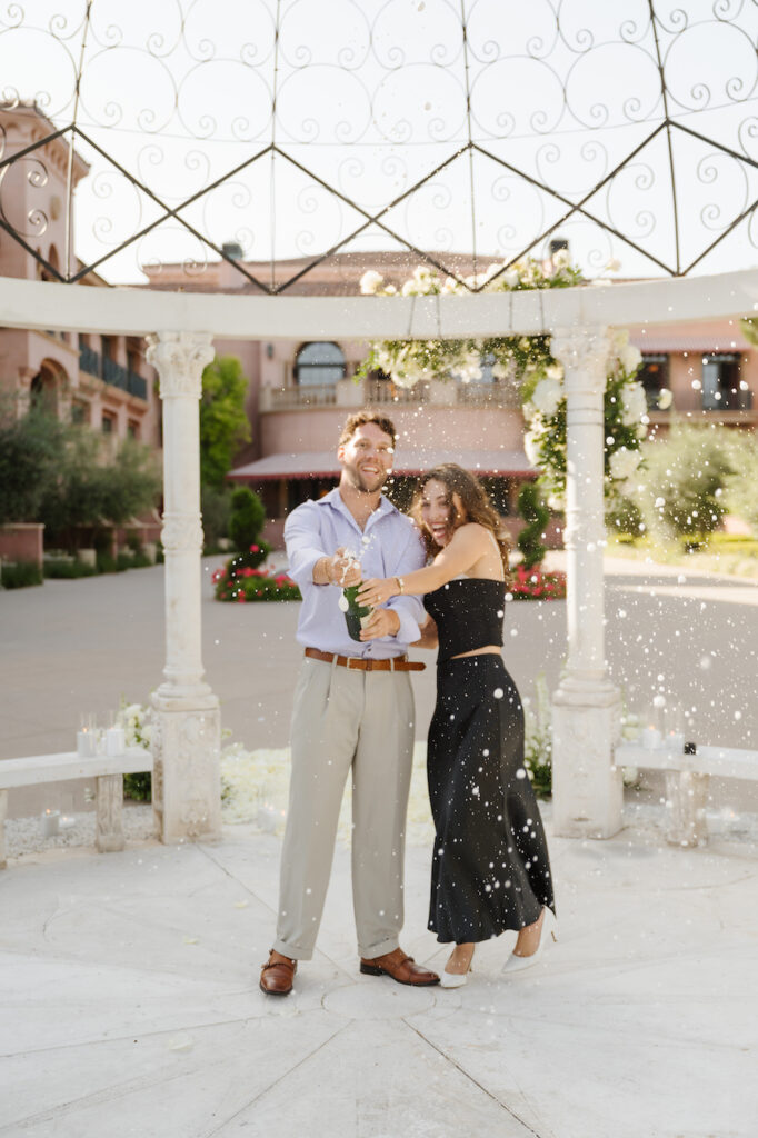 Newly engaged couple celebrating in the courtyard